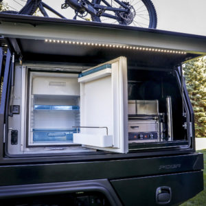 On the driver’s-side of the PCOR storage system of the Jeep To